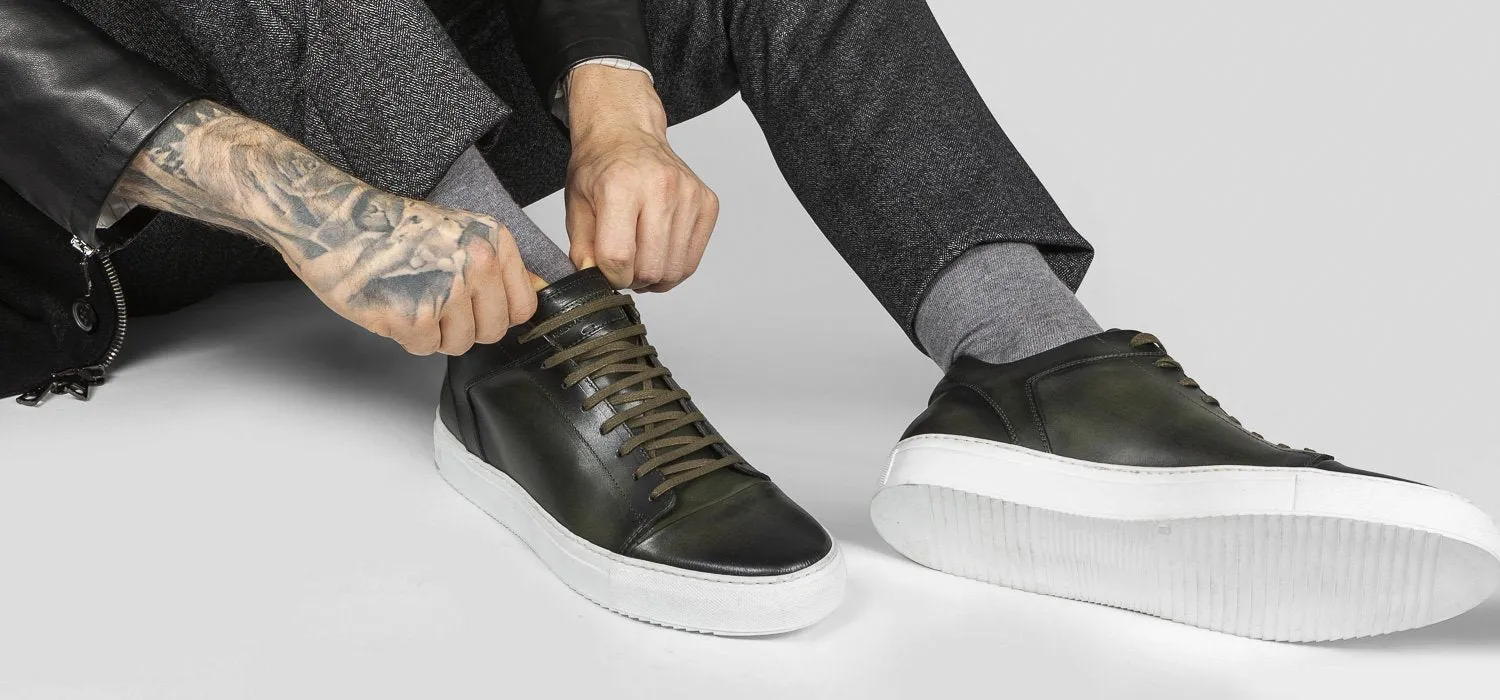 SOHO forest-green cap toe patina sneakers.