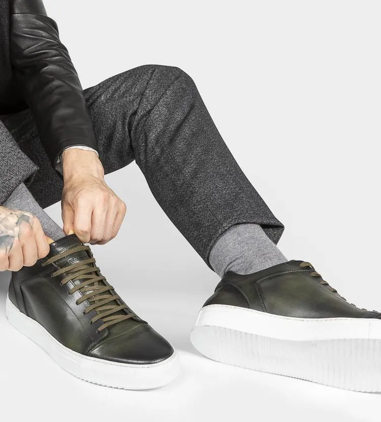 SOHO forest-green cap toe patina sneakers.