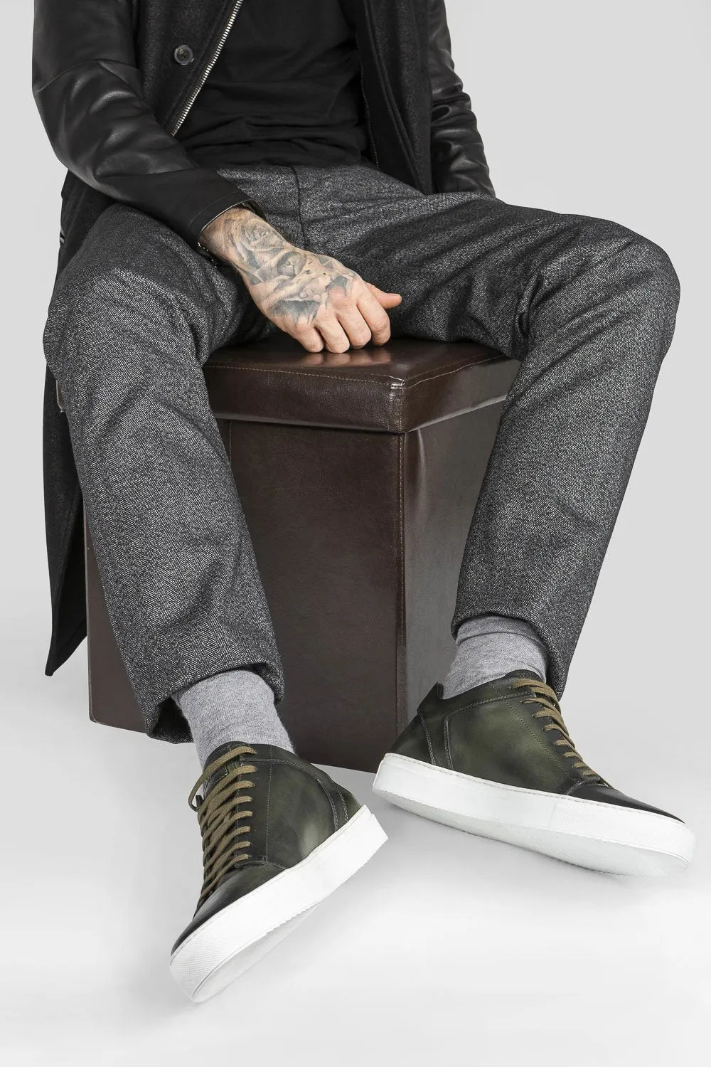 SOHO forest-green cap toe patina sneakers.